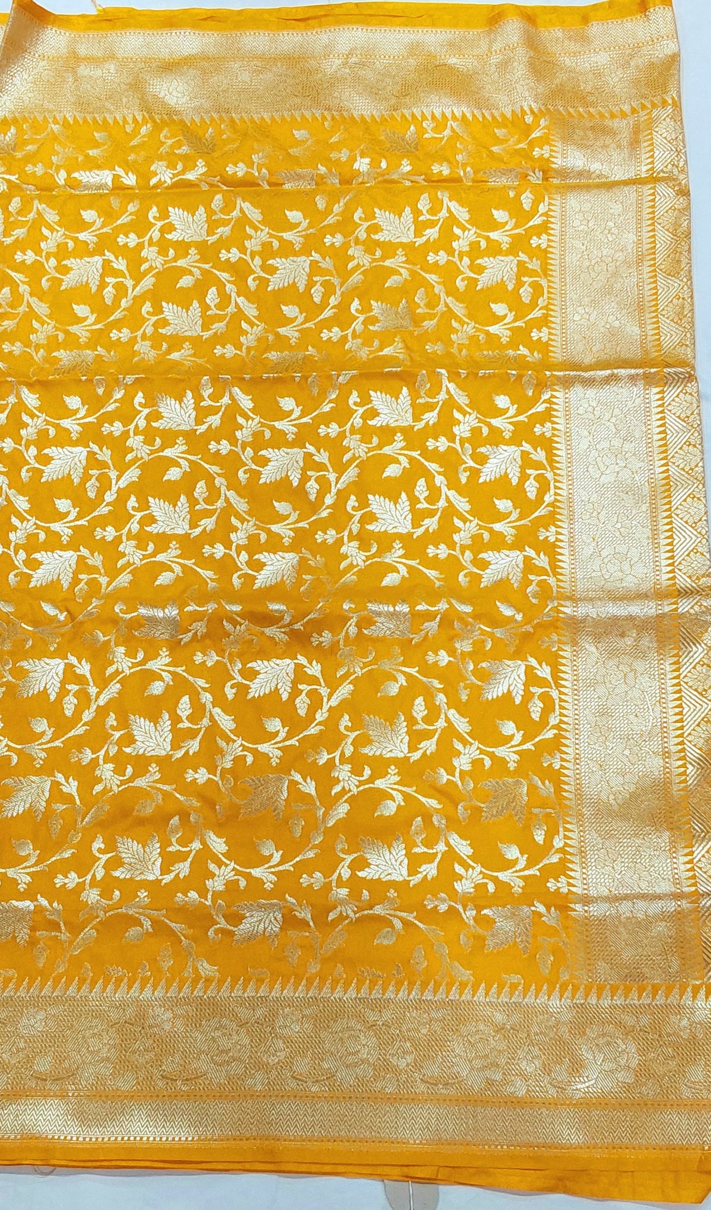 Yellow Banarasi Saree with Silver Zari Kodi Malar Designs