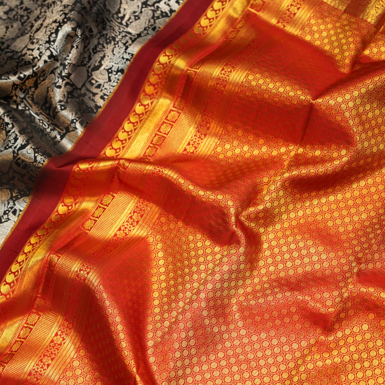 Handcrafted Kanchipuram Silk saree Black color with red color border