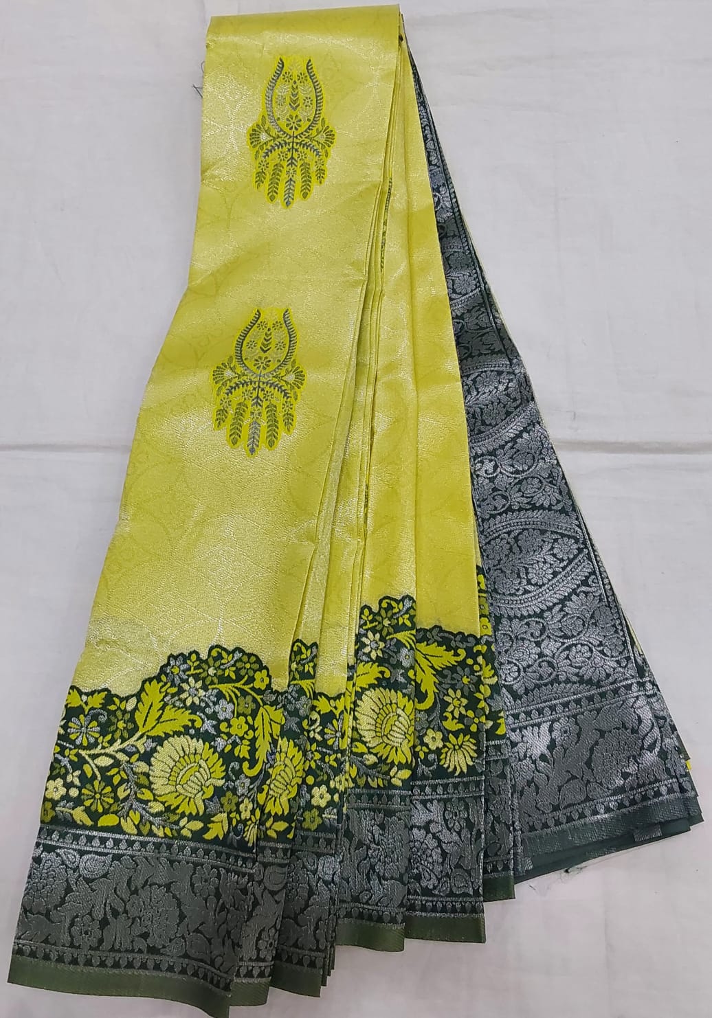 Lemon Yellow Color Semi Silk Saree with bottle green color Flower border