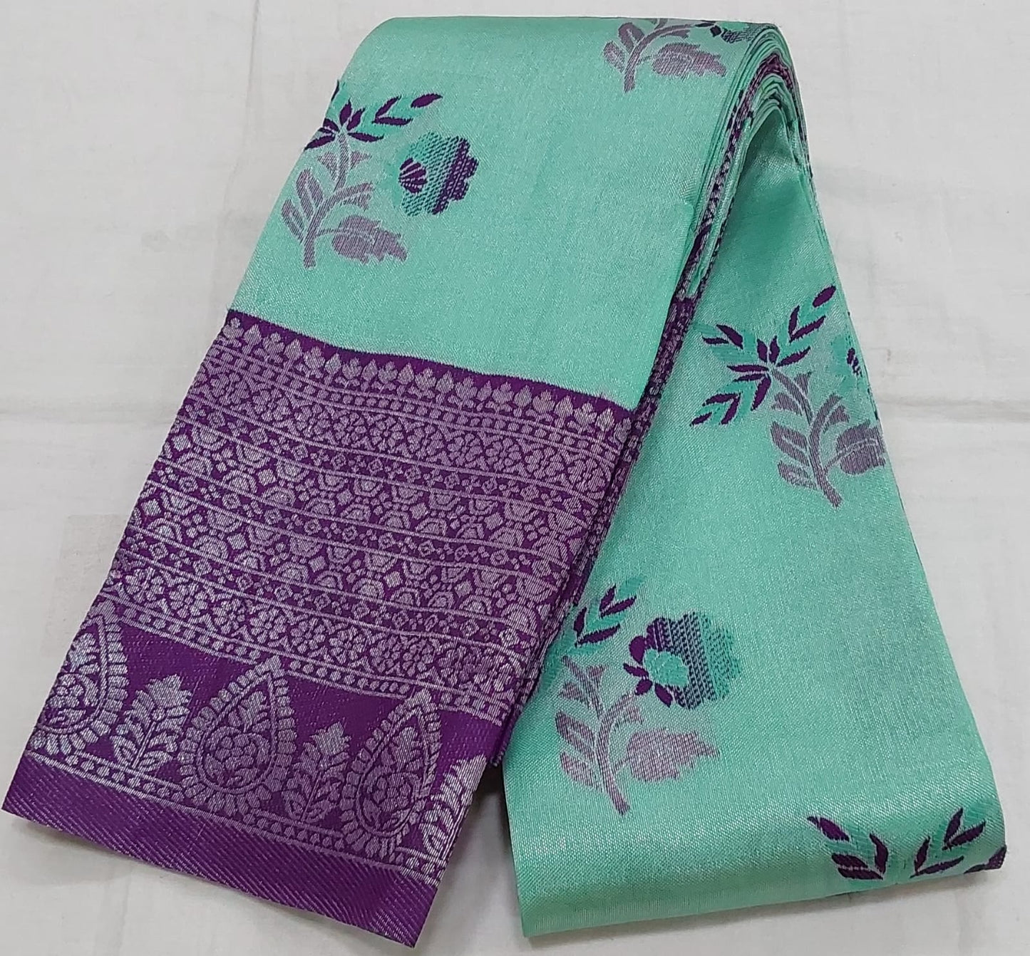 Rexona Green color semi silk saree with purple color border silver Zari work
