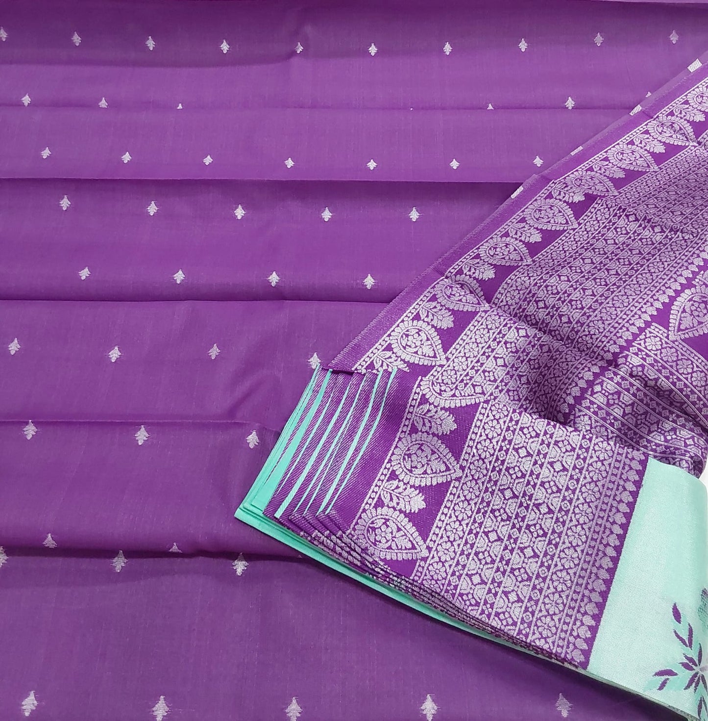 Rexona Green color semi silk saree with purple color border silver Zari work