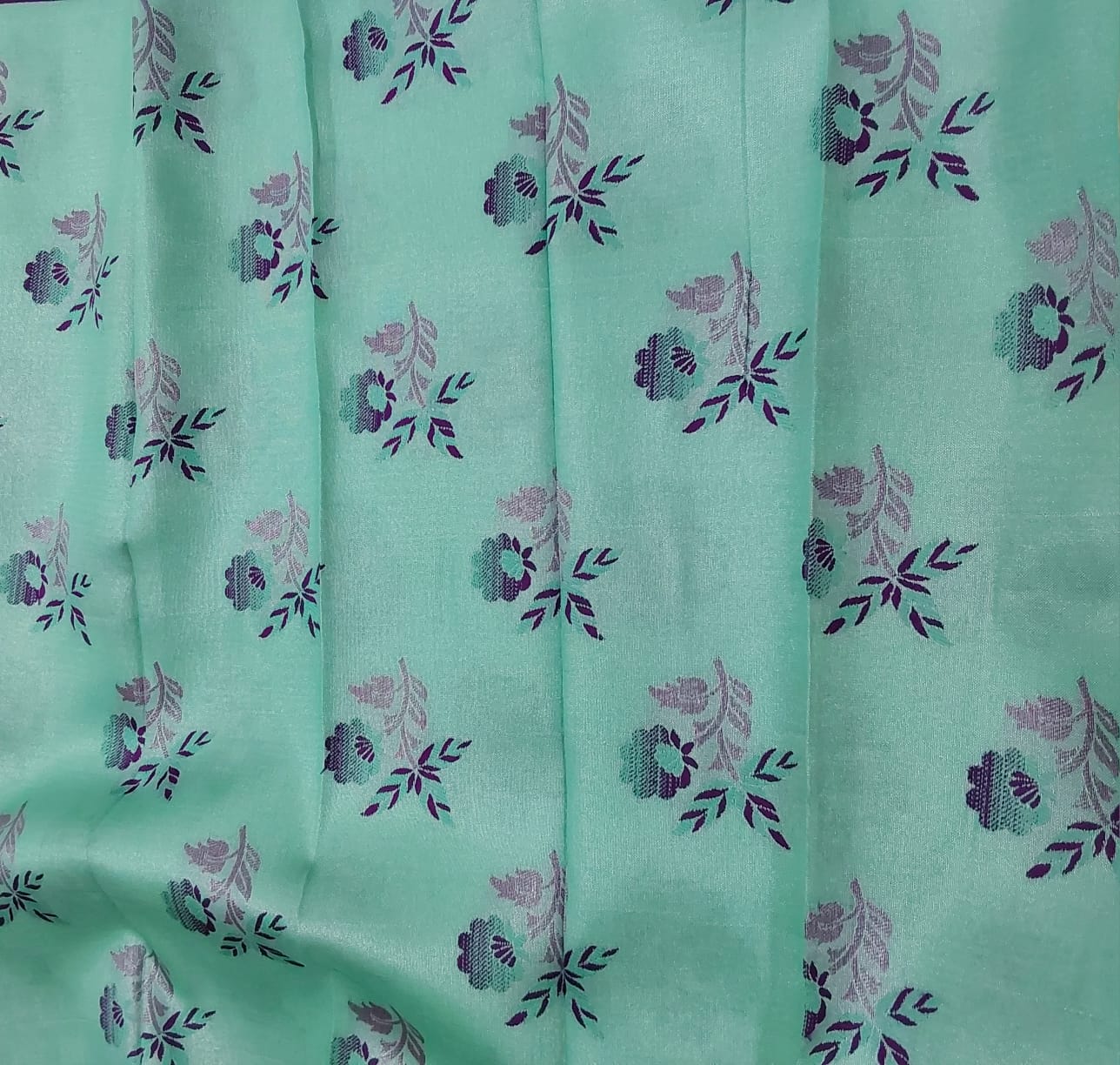 Rexona Green color semi silk saree with purple color border silver Zari work