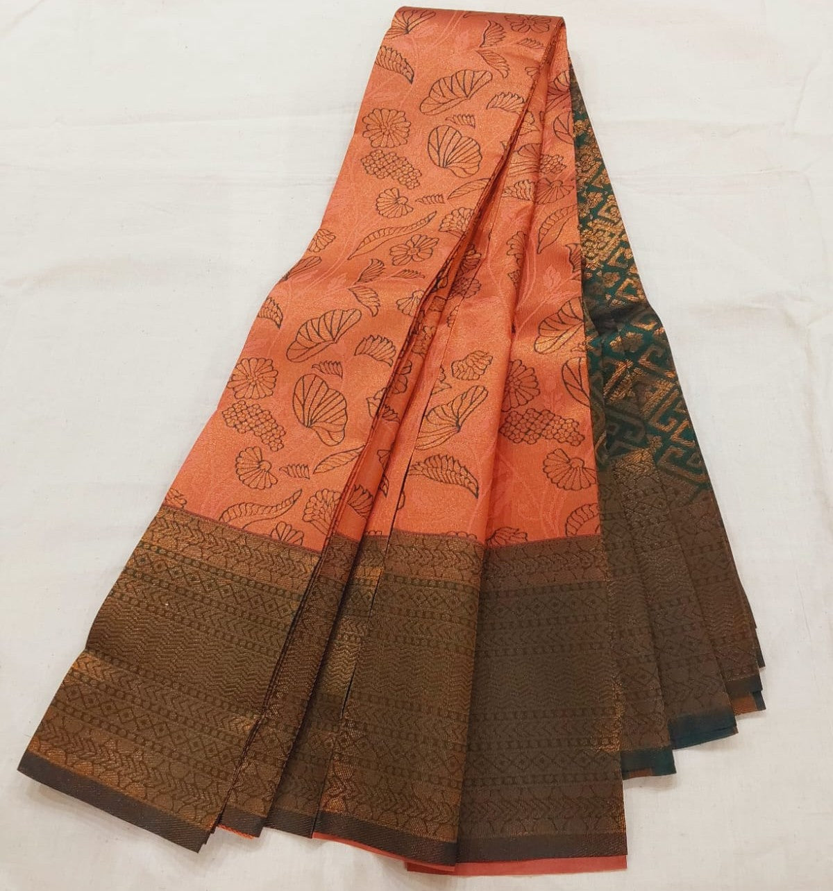 orange mixed brown color silk saree with bottle green border copper Zari border