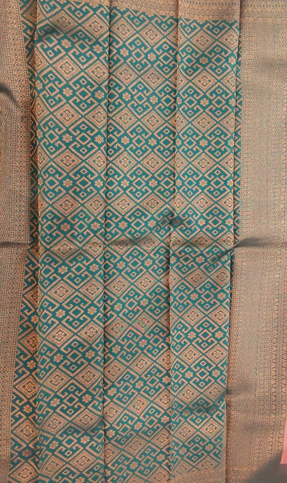 orange mixed brown color silk saree with bottle green border copper Zari border