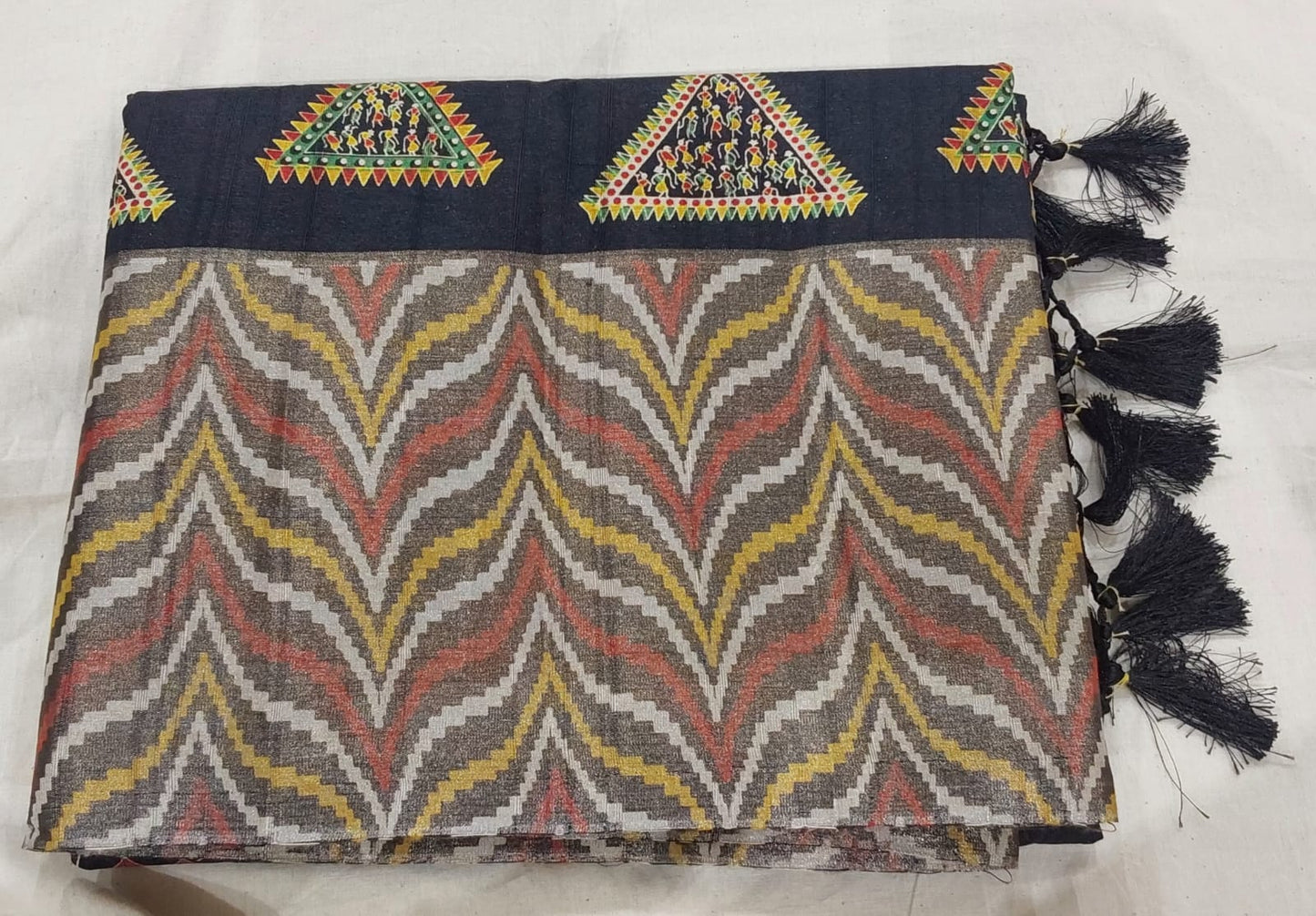 Fancy Black color Tussar Silk saree with Zari border