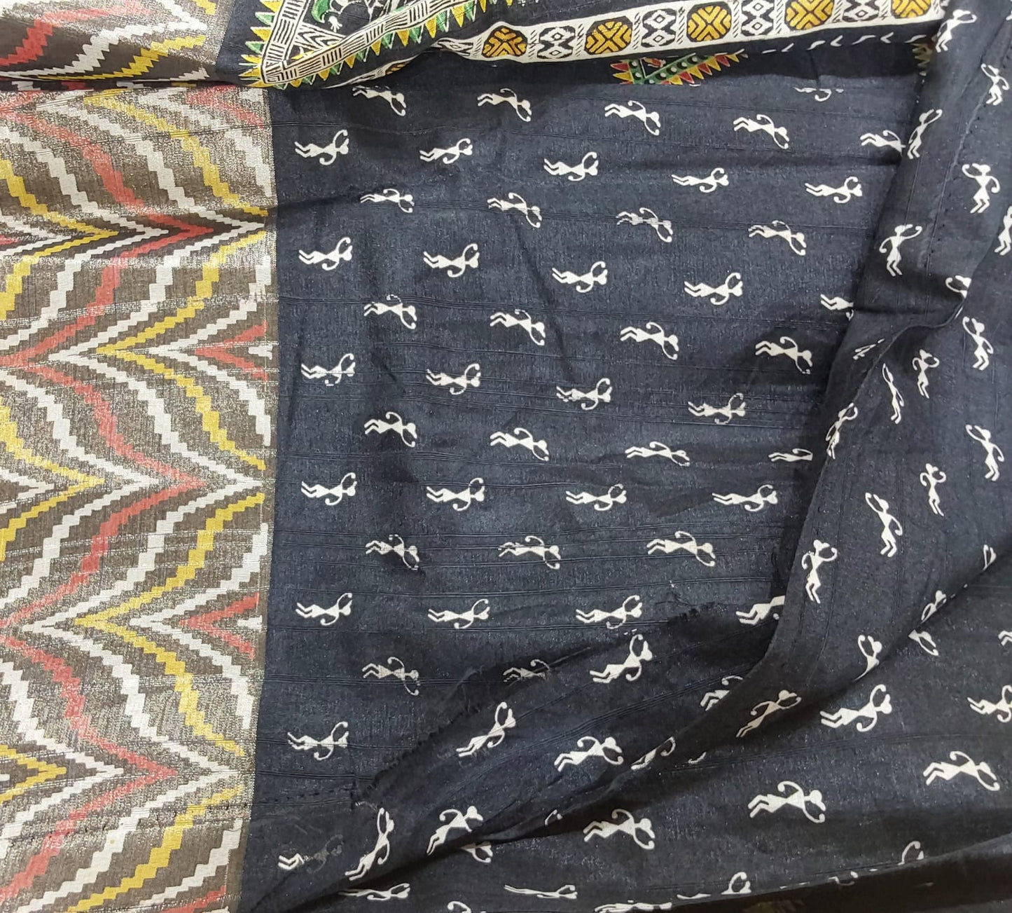 Fancy Black color Tussar Silk saree with Zari border