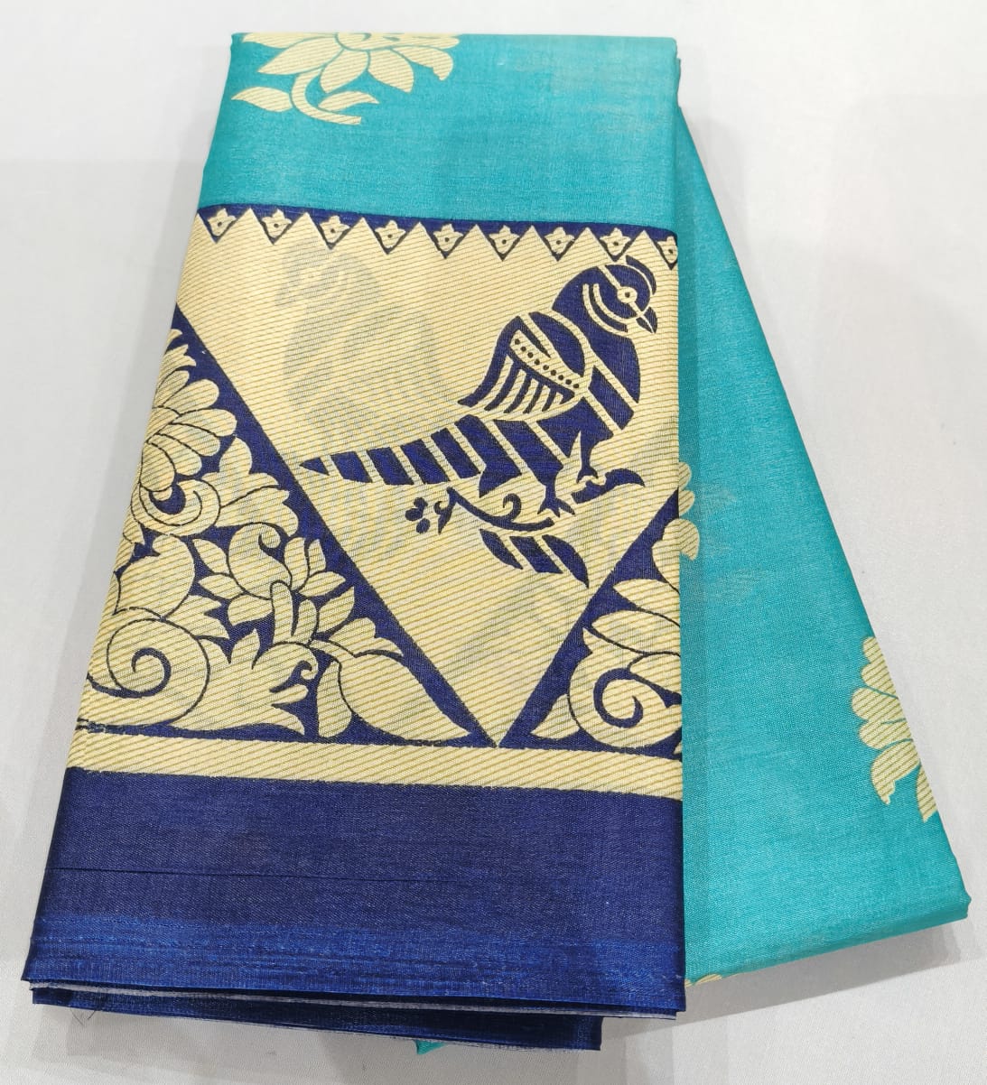 Fancy Saree Rexona Green color with dark blue color flower design border