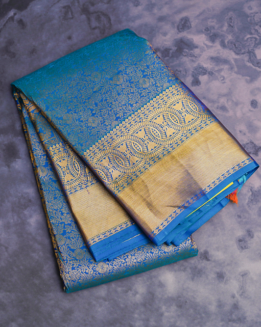 Blue Kanchi Silk Wedding Saree with Lotus Circle Border and Kodi Malar Design