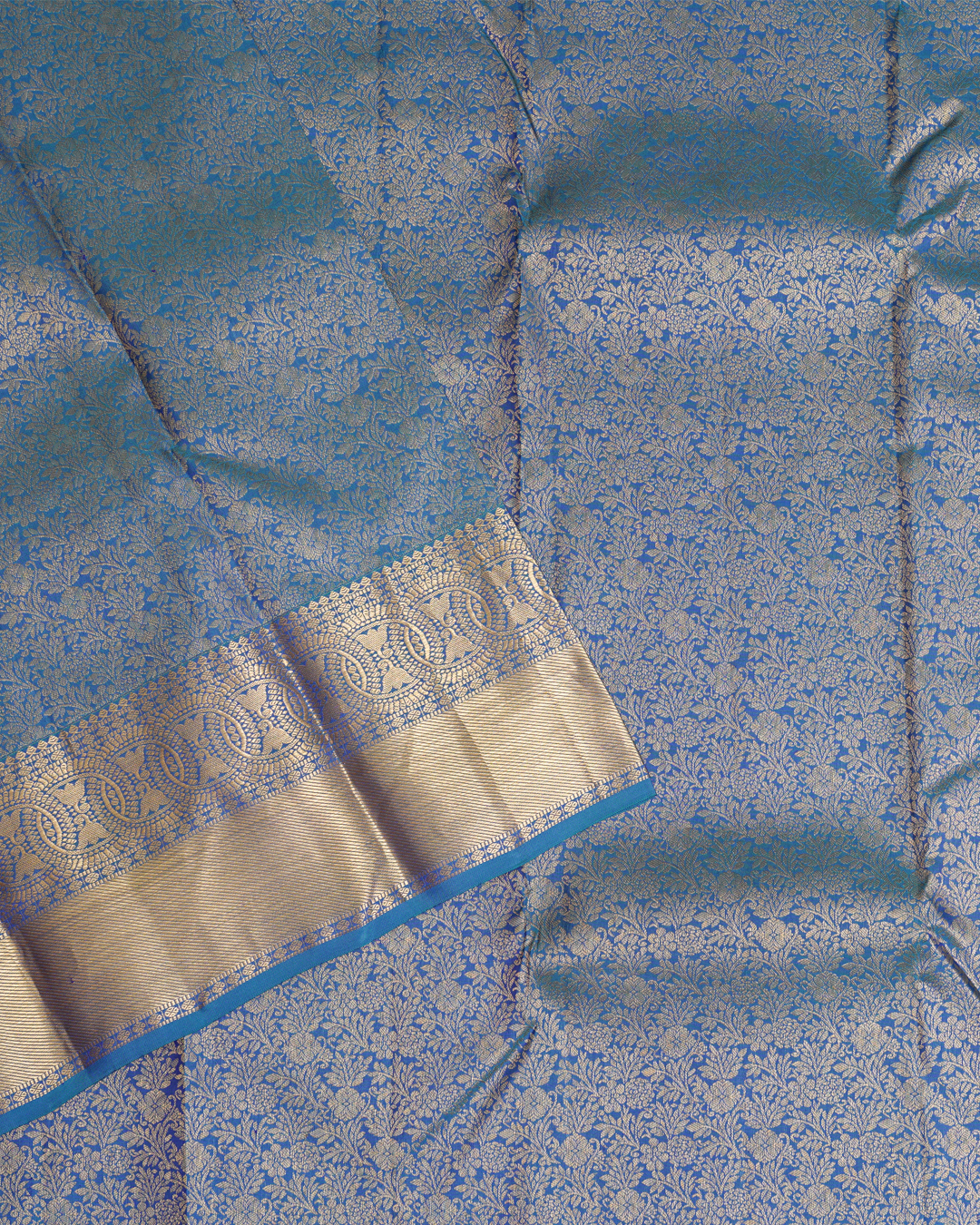 Blue Kanchi Silk Wedding Saree with Lotus Circle Border and Kodi Malar Design