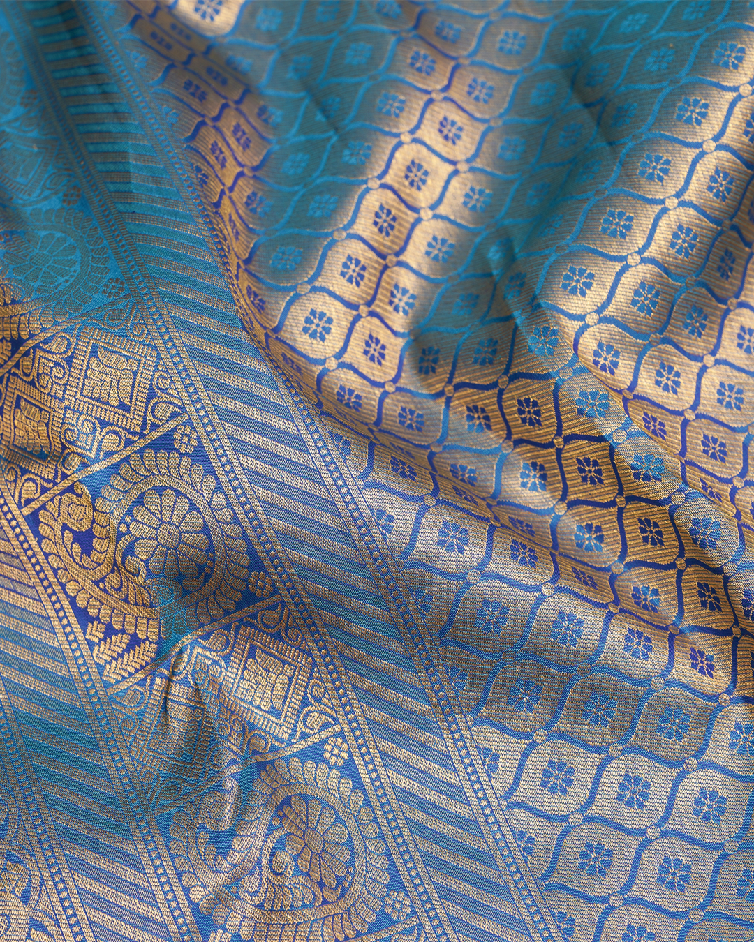 Blue Kanchi Silk Wedding Saree with Lotus Circle Border and Kodi Malar Design