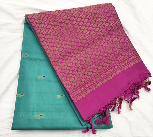 🌿 Drape yourself in grace with this Rexona Green Pure Soft Silk Saree, featuring elegant butta motifs woven with finesse.